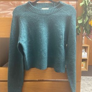 dark green sweater